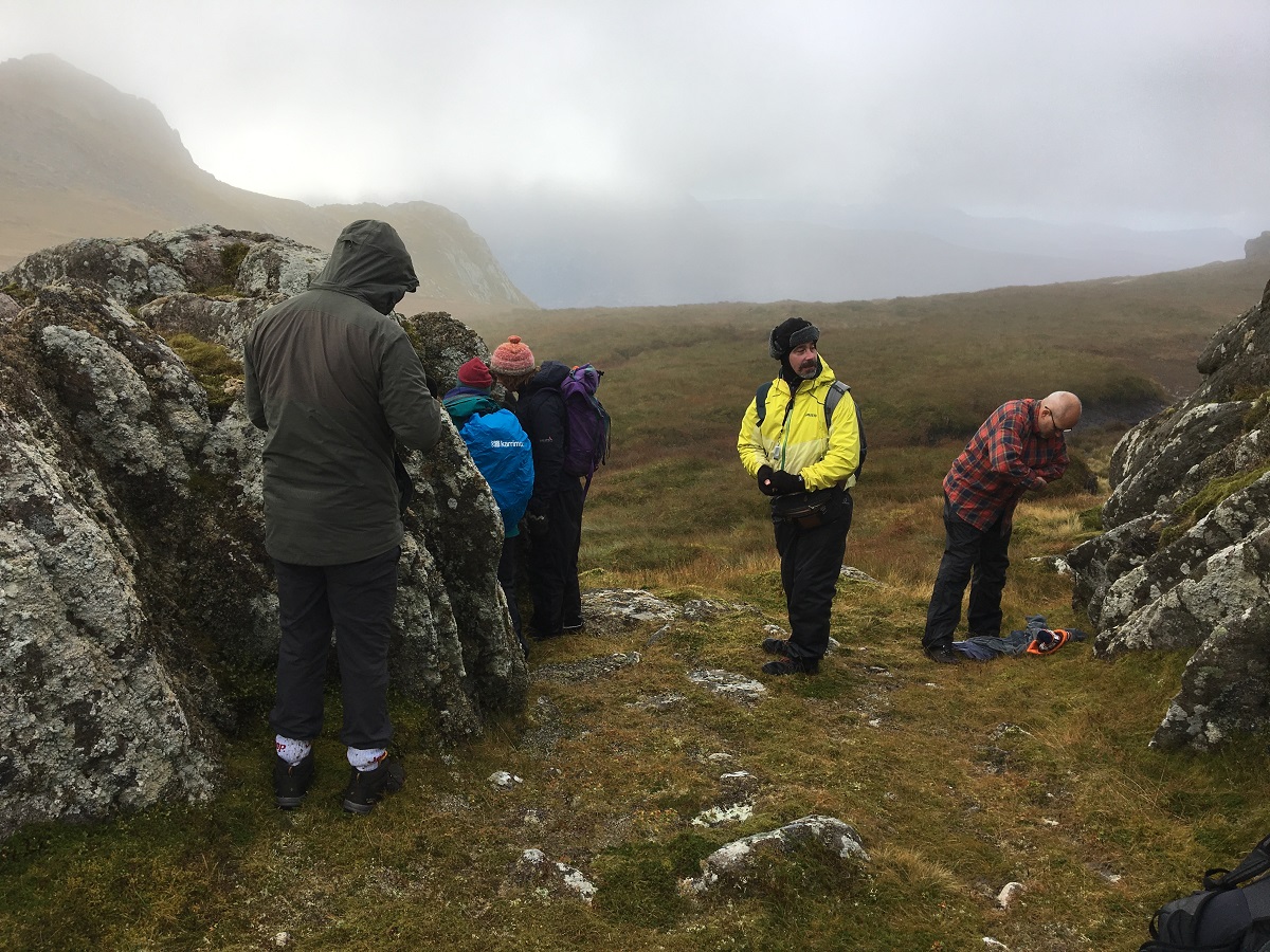The expedition group studying rocky outcrops on Ben Loyal, Sutherland - LAFF 2019 (c) April Windle